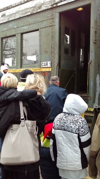 boarding the santa train car